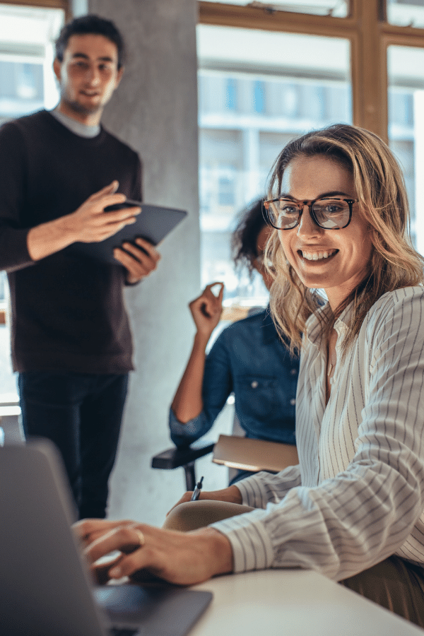 image of three people in a office
